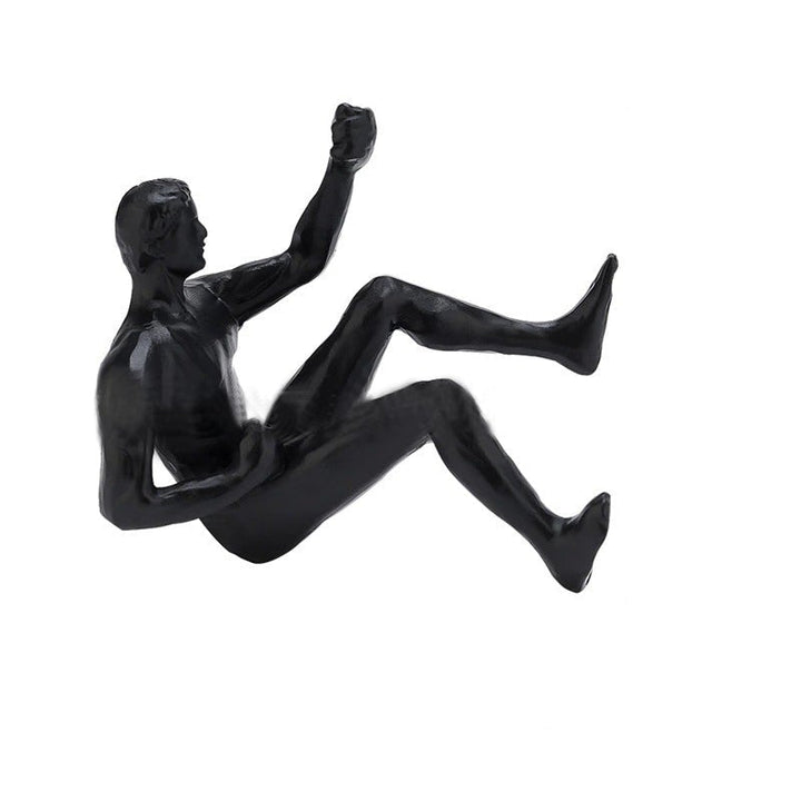 Kletterwand hängende Statuen