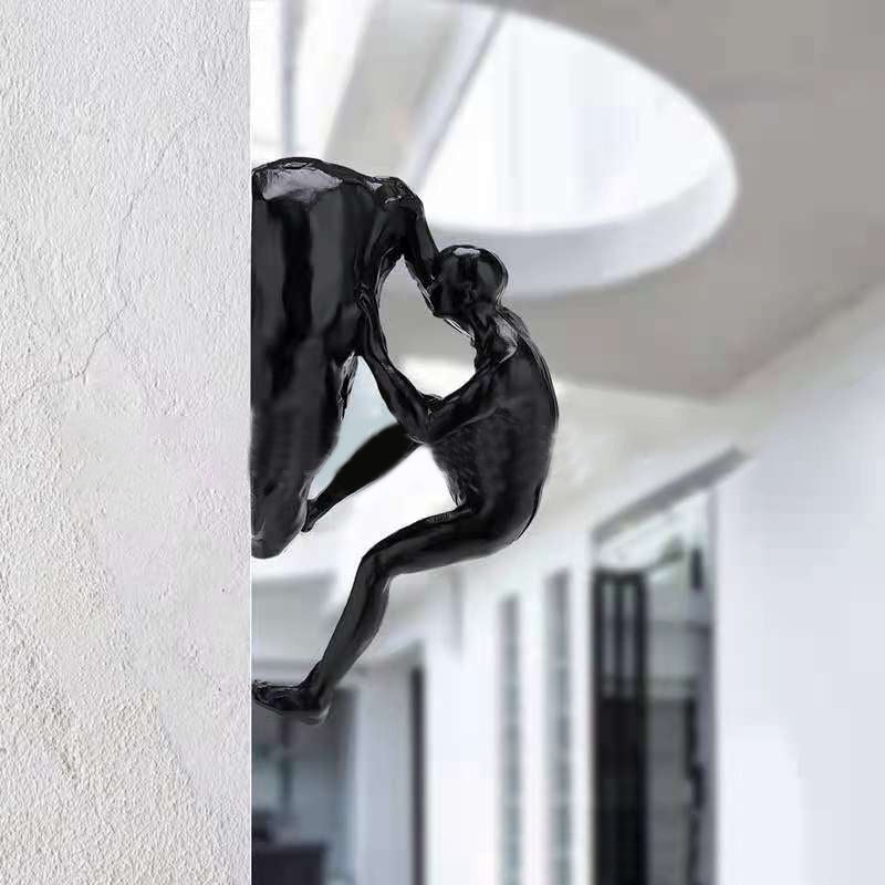 Kletterwand hängende Statuen